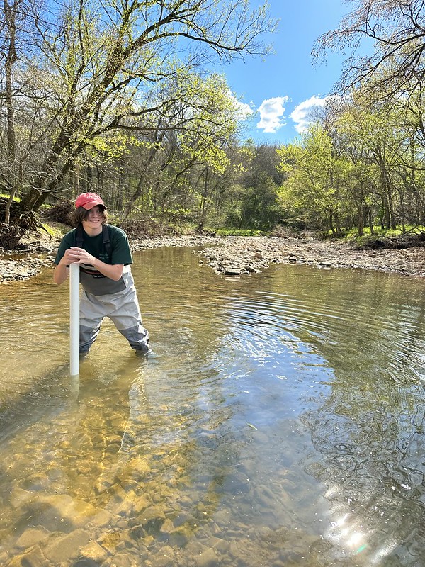 Jacob Major takes stream soil samples on a tributary of the White River