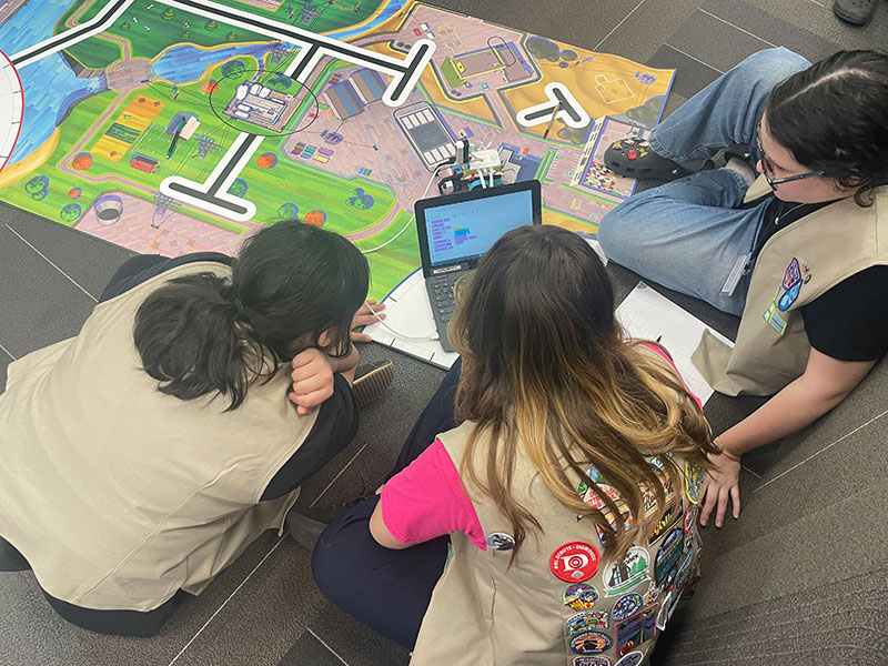 Girl Scouts working on a mapping project at Barbie Mini-Camp