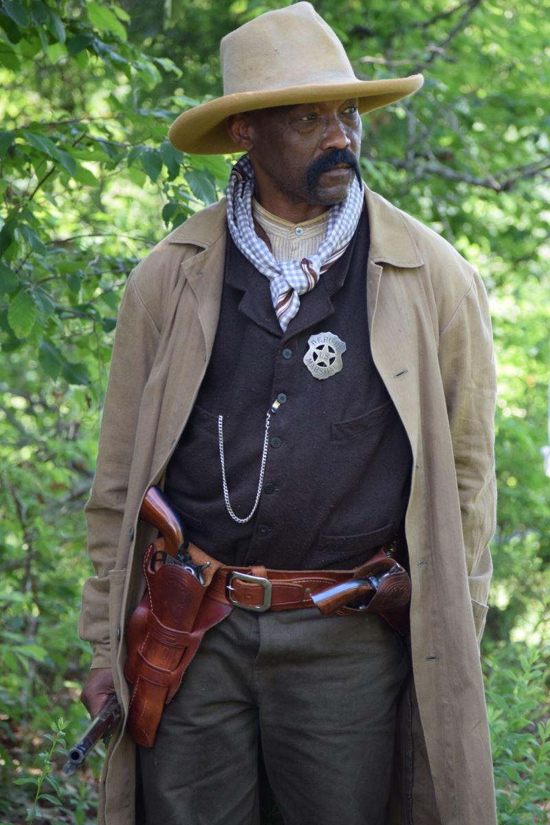 A historical re-enactor dressed as Bass Reeves