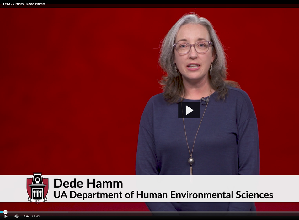 Still image from video of Dede Hamm on red background