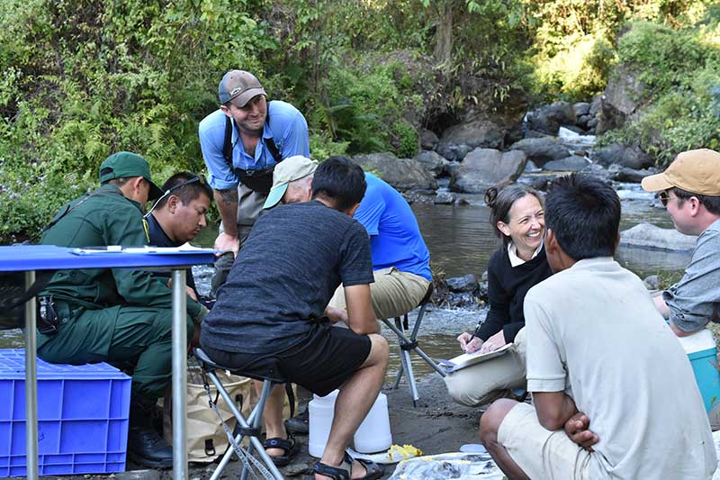 The Douglases processing fishes with two of their U of A graduate students and Bhutanese fish biologists