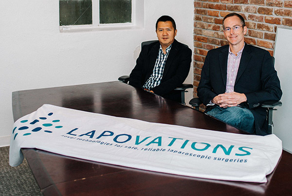Nhiem Cao, left, and Jared Greer of Lapovations in a U of A Startup Village conference room.