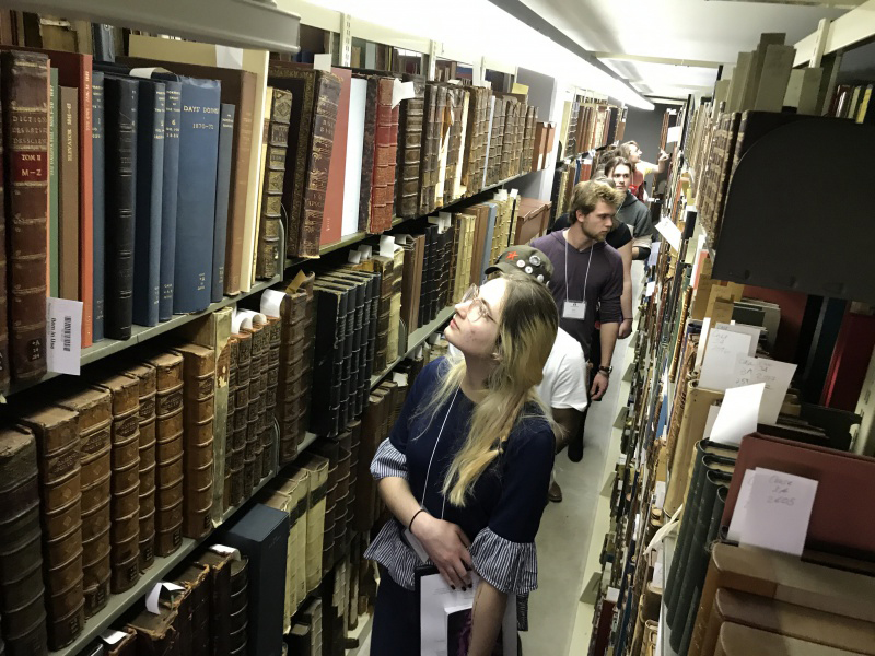 Undergraduate students tour library stacks