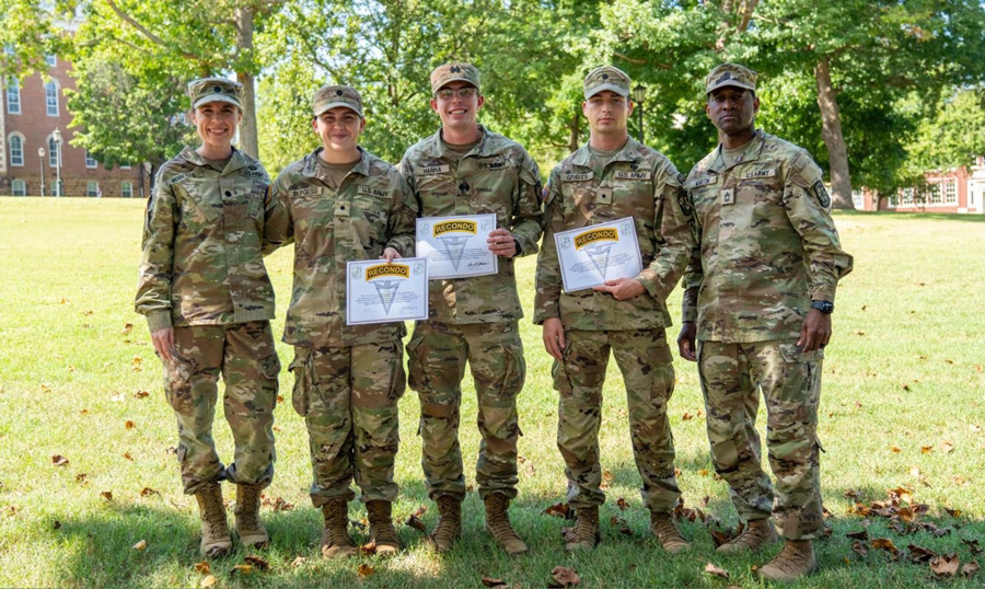 Lt Col Sidney Roberts and cadets Mary Burgess Nile Hanna and Quinn Graves and Master Sgt Jermaine Martin, senior military instructor