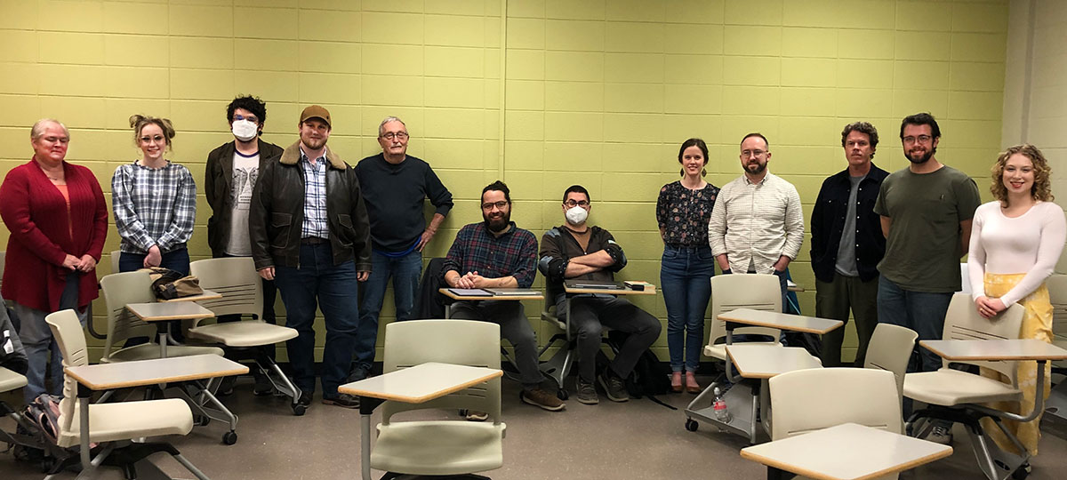 Bob Cochran and students in a class examining the works of author Charles Portis