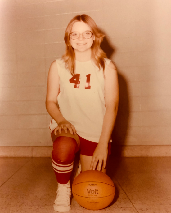 1970s photo of Carla Martin in basketball uniform