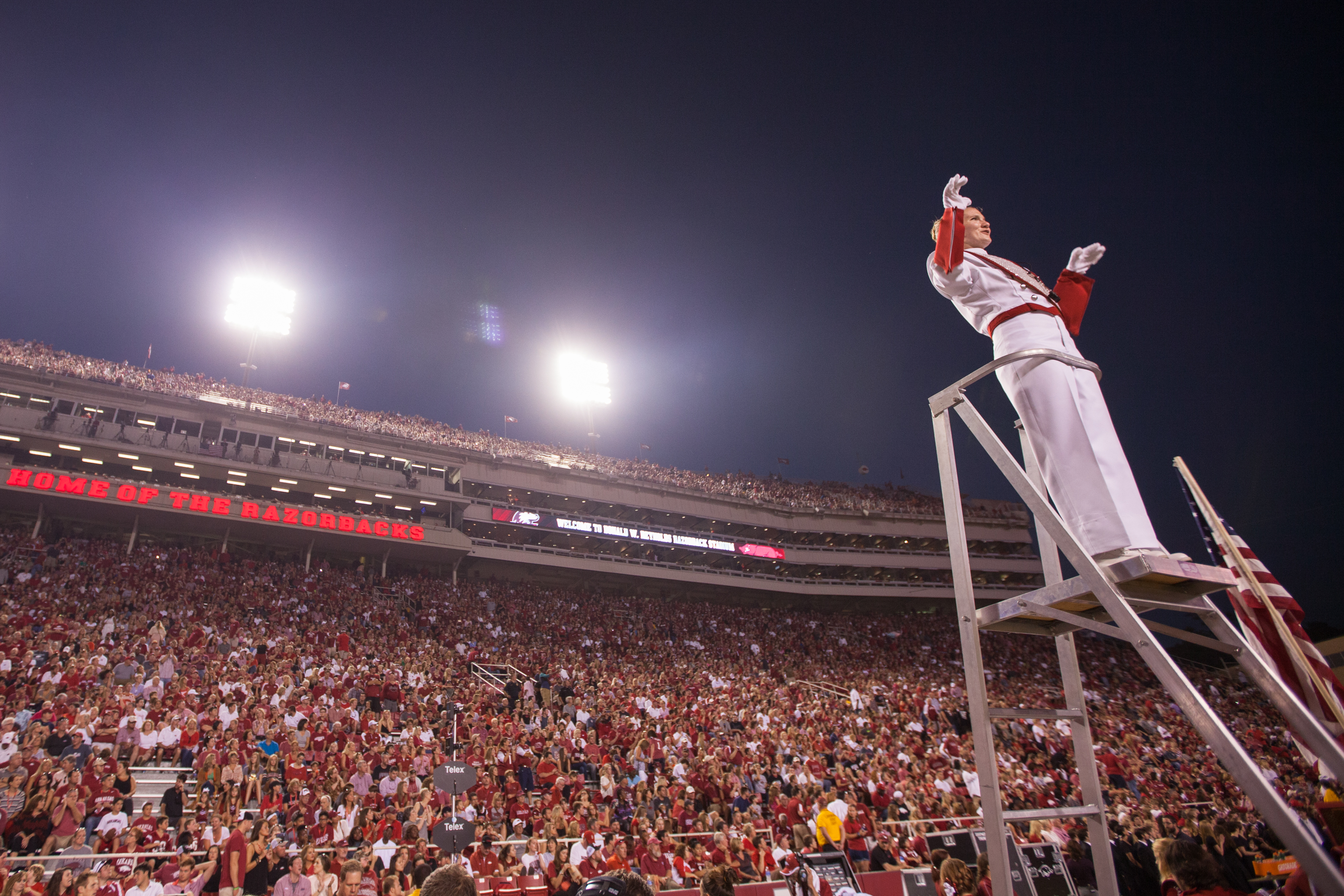 Head drum major Jamey Julian leads the Razorback Marching Band during a recent halftime performance. (Photo by Matt Reynolds.)
