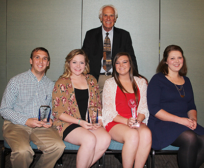 Members of the University of Arkansas national poultry judging team are (back row) Coach Dennis Mason and (seated left to right) Alex Durham, Audrey Foster, Morgan Stephens and Lainyn Kerley.