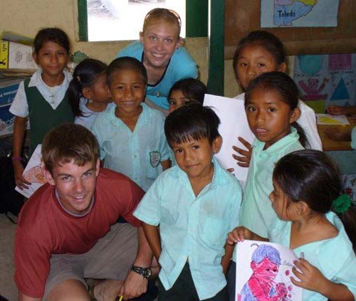 U of A students connect with schoolchildren on a previous trip to Belize.
