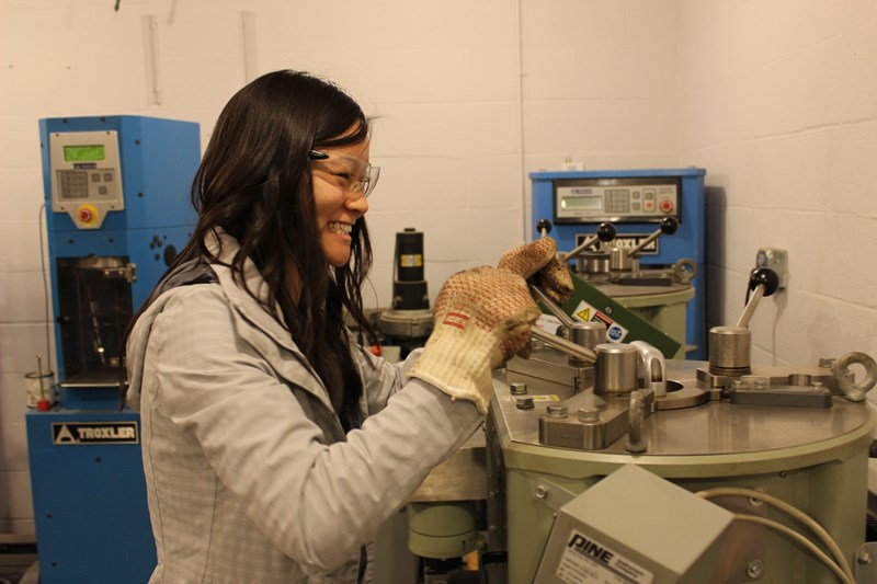 Erica Yeung, an undergraduate senior from Miami, Oklahoma, is researching asphalt emulsion, a new kind of asphalt that saves on energy and cost.