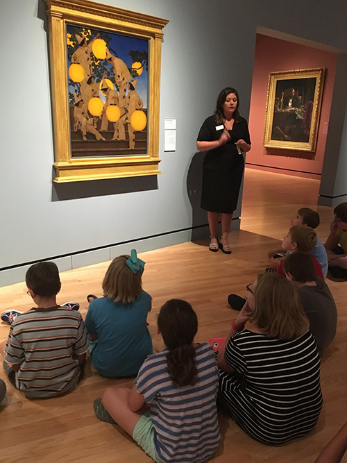 Emily Rodriguez talks about artwork with participants of Camp Connect at Crystal Bridges Museum of American Art.
