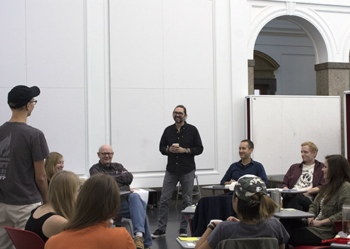 Michael Hendrix, standing at center, talks with Fay Jones School of Architecture and Design students and faculty during the Design Thinking workshop last fall in Vol Walker Hall. The workshop was co-hosted by the Fay Jones School and the Honors College.