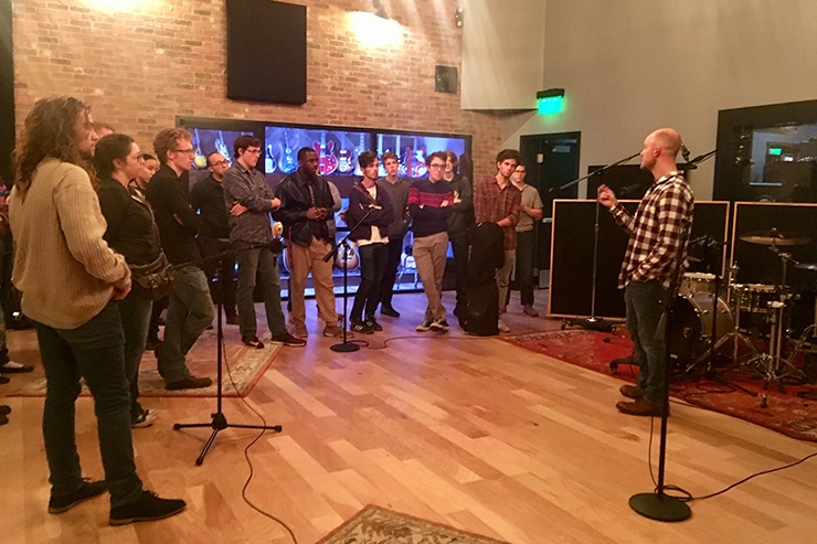 Several undergraduate students from the U of A's Department of Music visit Haxton Road Studios to meet Neil Greenhaw, right, the studio's owner and a professional sound engineer, producer and studio musician.