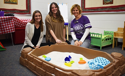 Ellen Bennett, from left, Wesley Goodson and Sarah Gheen show a playroom at Turnbow Elementary School in Springdale.