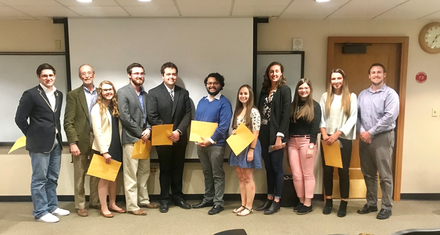The 2018 inductees of Delta Phi Alpha, with adviser Brett Sterling.