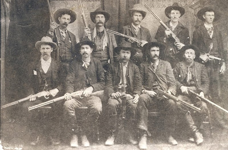 Deputy marshals and posse pictured after a fight with Ned Christie in the Indian Territory, November 1892. Back row from left: Tom Johnson, Bill Smith, John Tolbit, Abe Allen, Wes Bauman. Front row: Capt. G.S. White, Charles Copeland, Paden Tolbert, Heck Bruner, Dave Rusk.