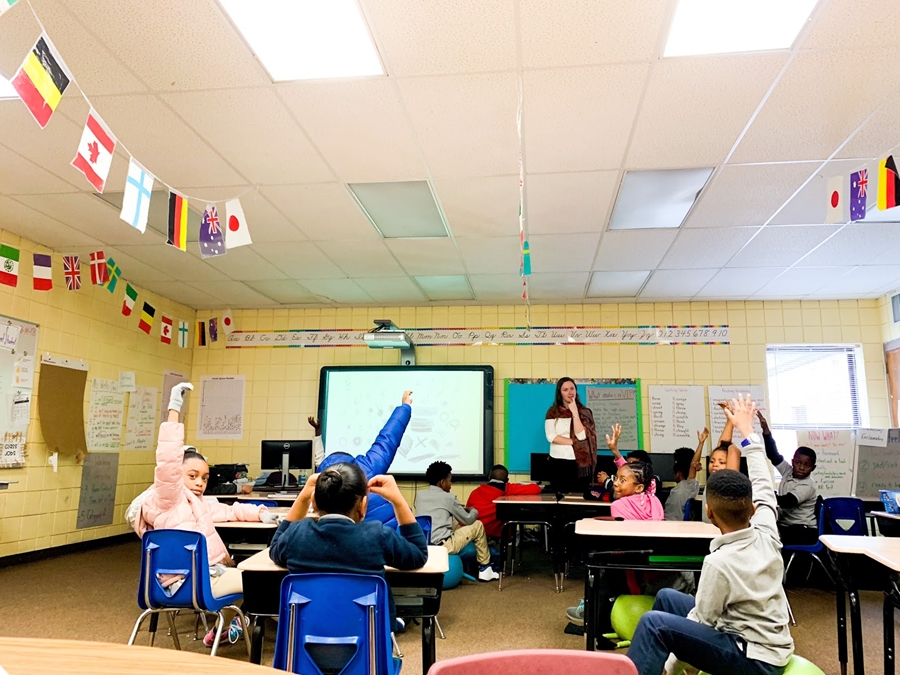 Delaney Wells, a Arkansas Teacher Corps Fellow, leads a discussion with her third-grade students at James Matthews Elementary in the Dollarway School District, which serves parts of Pine Bluff.