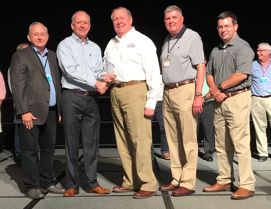 Presenting the Industry Leader of the Year award to  John Marcy (center) was TPF's current Board of Directors and Marvin Childers (second from left), TPF president.