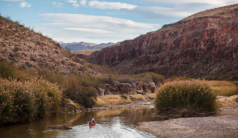 Two students canoe down the Rio Grande River as part of the University Recreation Outdoor Leadership Institute.