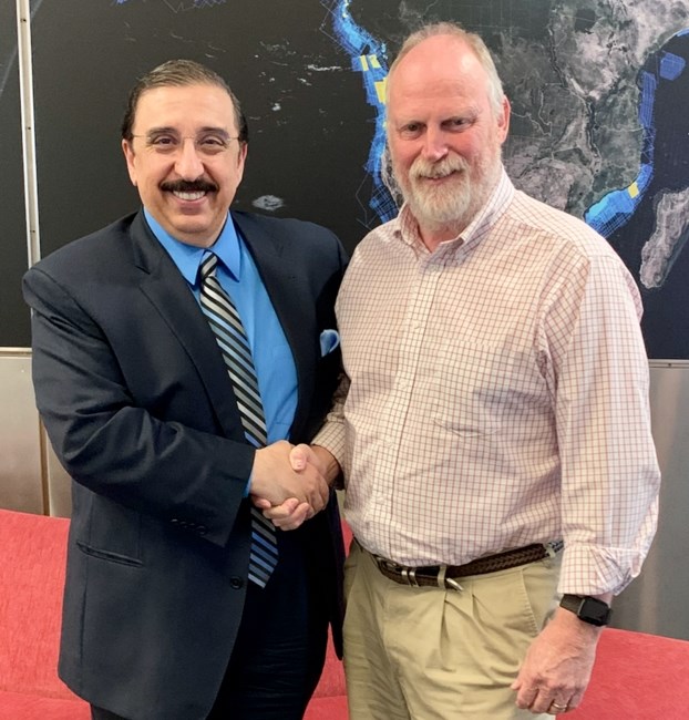 Maurice Nessim, president of WesternGeco, Schlumberger, left, with professor Christopher Liner, U of A's chair of geosciences, at WesternGeco headquarters in Houston, Texas.