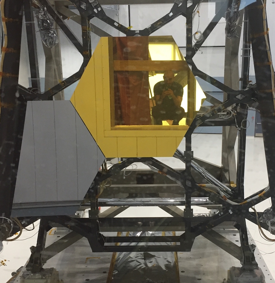 Part of the upcoming James Webb Space Telescope at Goddard Space Flight Center, now set to launch in 2021. Bonney is reflected in the mirror.