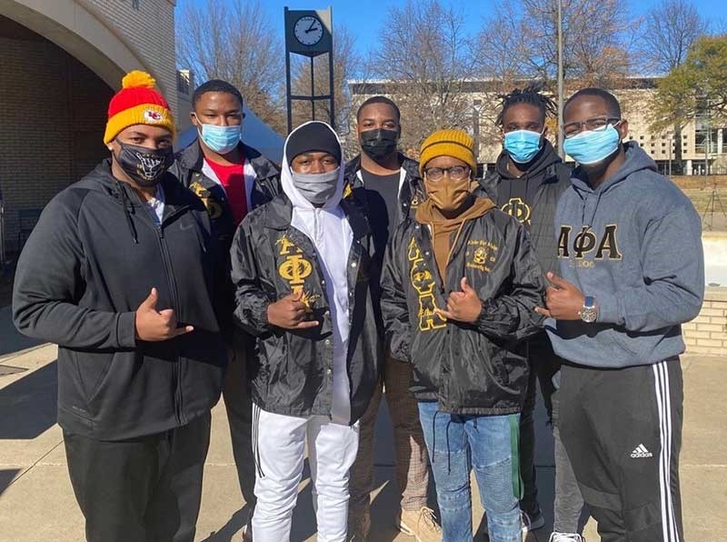 Members of Alpha Phi Alpha collected canned goods to support Life Source International.