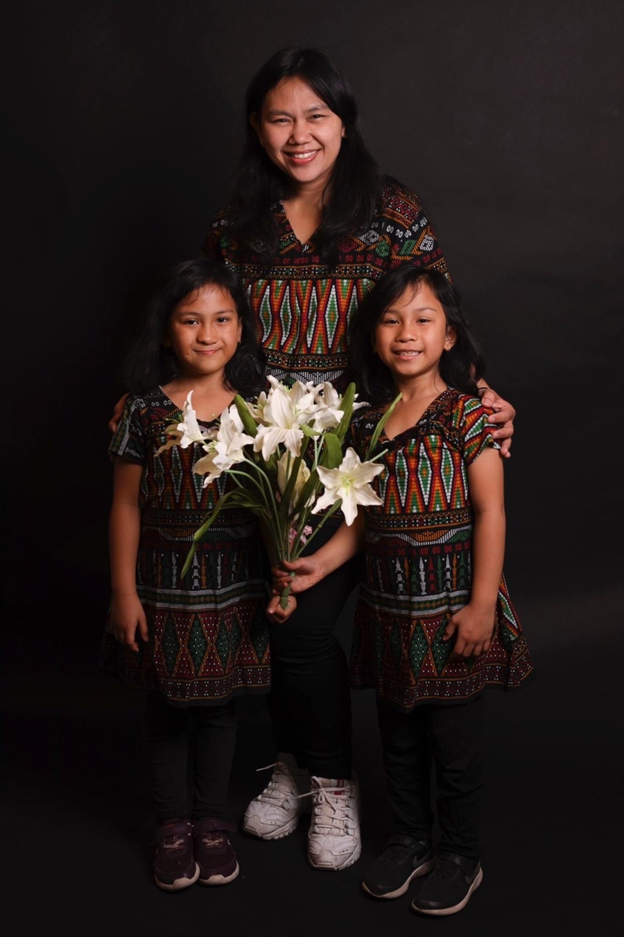 Student Eva Caroline Stephani from Indonesia celebrating with her daughters.