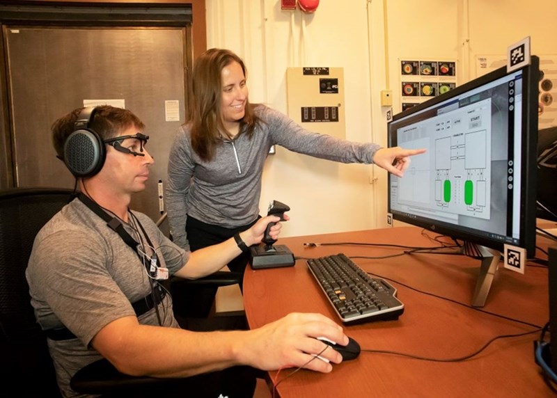 Alumna Hillary Plummer analyzes data at the U.S. Army Aeromedical Research Laboratory.