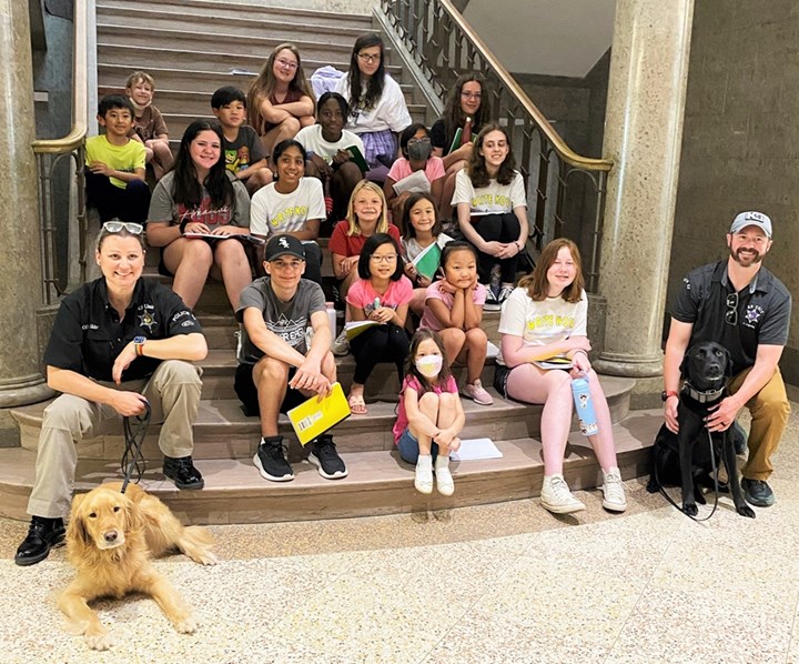 Young Writers Camp students recently interviewed the U of A Police Department's K9 handlers about their dogs, Faye and Oakley.