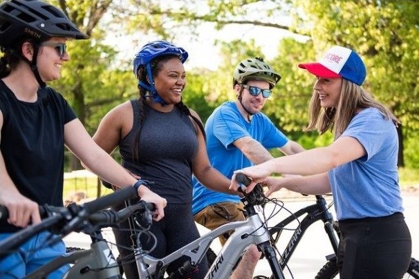 Morgan Baumgardner (far right) and her husband, Tyler Baumgardner, established Encore Bike Rentals after settling in Northwest Arkansas in 2021. Their startup aims to help residents "ride like a local" on the region's trails.
