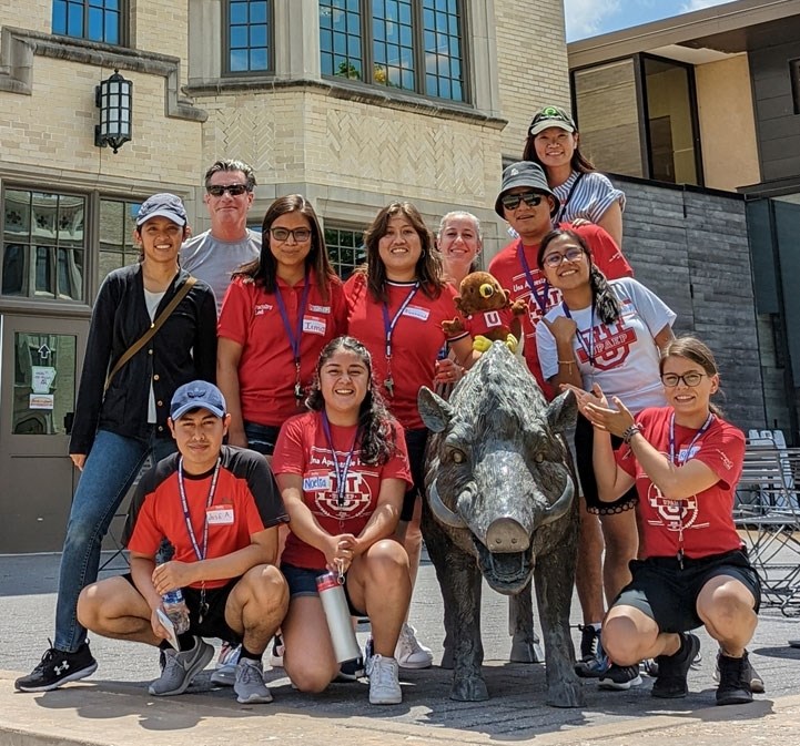 Students from Universidad Popular Autónoma del Estado de Puebla pose for a picture with the Hog statue along with program leaders from the U of A.