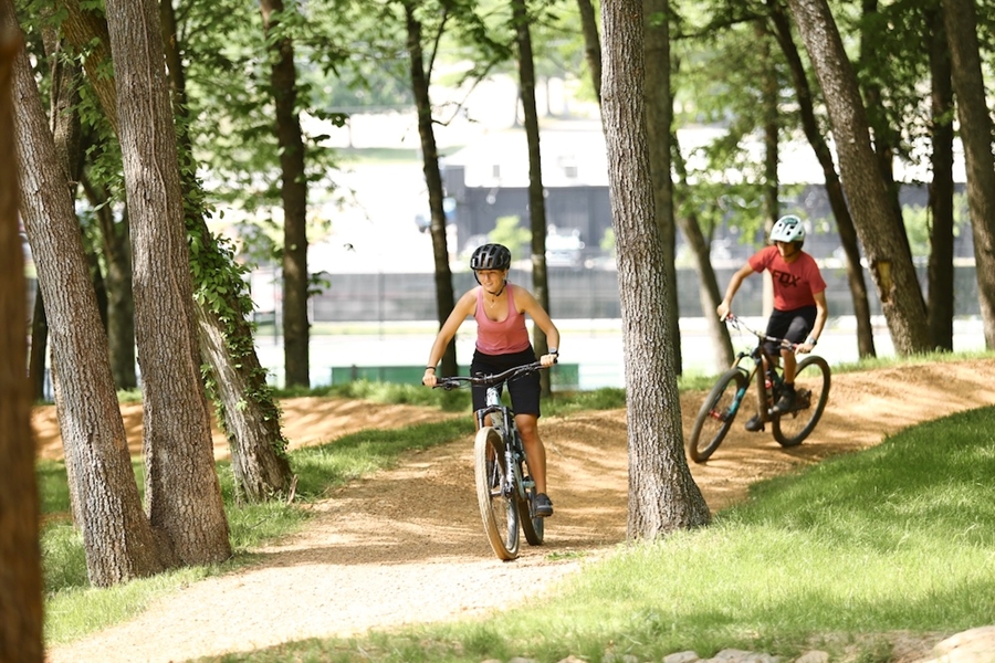 Riders cruising through the Tsa La Gi Bike Park, south of Martin Luther King Boulevard and the University Recreation tennis courts.