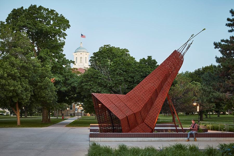 This sculpture called "Otaeciah (Crane)," created by Chris Cornelius, is located on the campus of Lawrence University in Appleton, Wisconsin. The installation is dedicated to the Menominee Nation and their ancestral homelands, on which the university's campus is located.