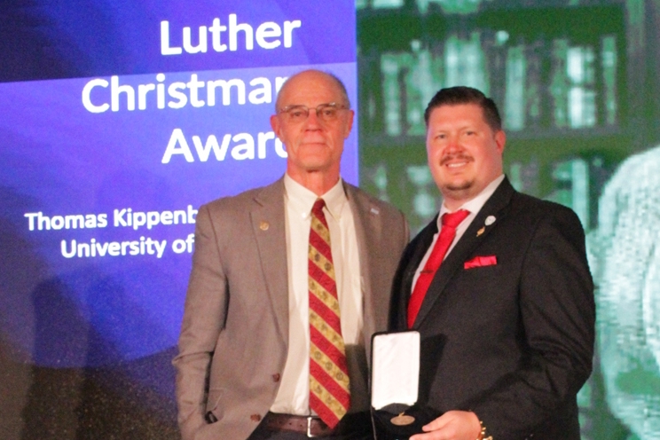 Professor Thomas Kippenbrock (left) received the Luther Christman Award at the American Association of Men in Nursing Conference. He's pictured with Blake Smith, association president.