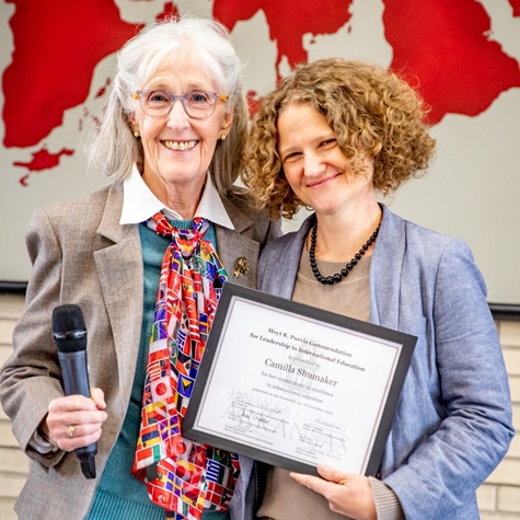 Camilla Shumaker (right) is honored with the Hoyt Purvis Award for a university staff member who contributes to the success of international students by Fran Hagstrom, interim associate dean of international education.