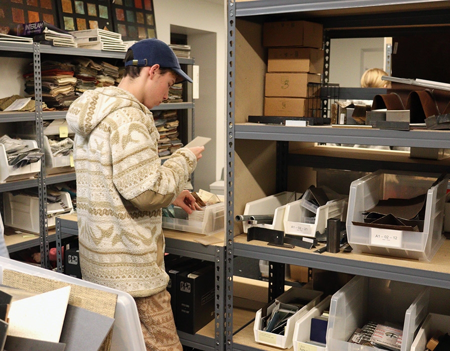 A design student looks through materials samples available in the Materials Lab, on the lower level of Vol Walker Hall.