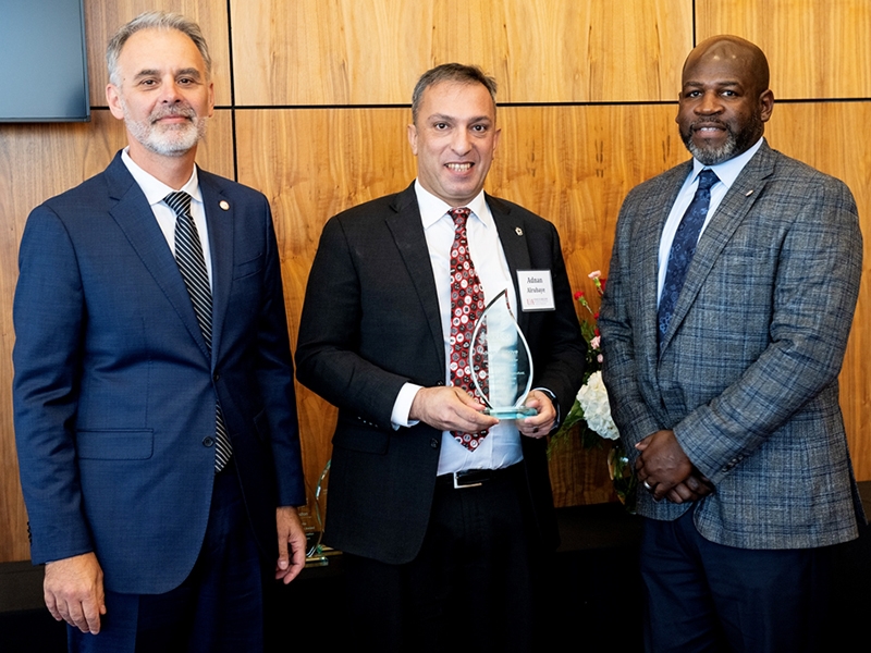 Adnan Alrubaye (middle), assistant professor of poultry science and associate director of the Cell and Molecular Biology Graduate Program, was awarded the Jack G. Justus Award for Teaching Excellence. With him are, left, Jean Francois Meullenet, interim dean of Bumpers College, and Deacue Fields, vice president of the Division of Agriculture.