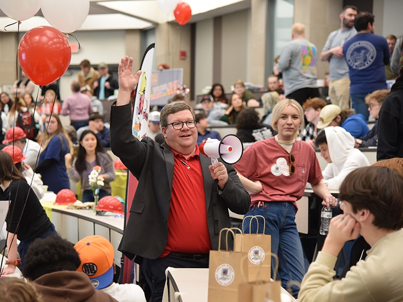 Dale Thompson, professor and associate department head, welcomes students after they have announced their choice to join the Department of Computer Science and Computer Engineering.