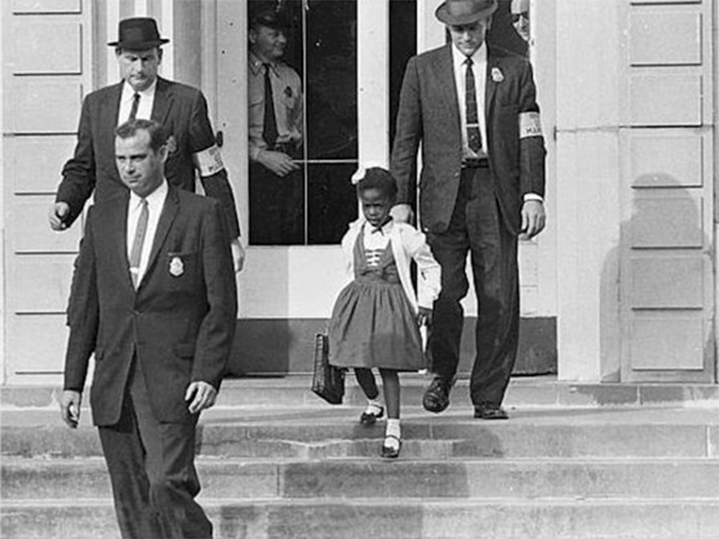 U.S. Marshals escort 6-year-old Ruby Bridges to and from Frantz Elementary in New Orleans, Louisiana, amid ongoing protests in November of 1960.