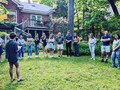 Chapter President Joshua Jacobs addresses members of Eta Sigma Phi during spring initiation at the home of professor Daniel Levine on May 6.