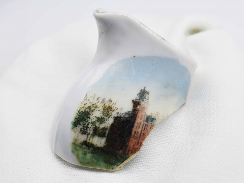 Porcelain jug fragment with Old Main illustrated on it. Found during excavations at the Ridge House in Fayetteville.