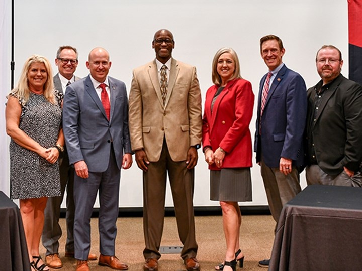 Announcing the agreement between the U of A and UACCM were (L-R) Karen Boston, Gary Peters, Brent Williams, Charles Robinson, Lisa Willenberg, Richard Counts and Robert Keeton.
