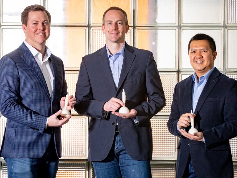 Lapovations executives, from left, Spencer Jones, Jared Greer and Nhiem Cao pose with Abgrab, the company's innovative surgical assistance device for use in laparoscopic surgery.