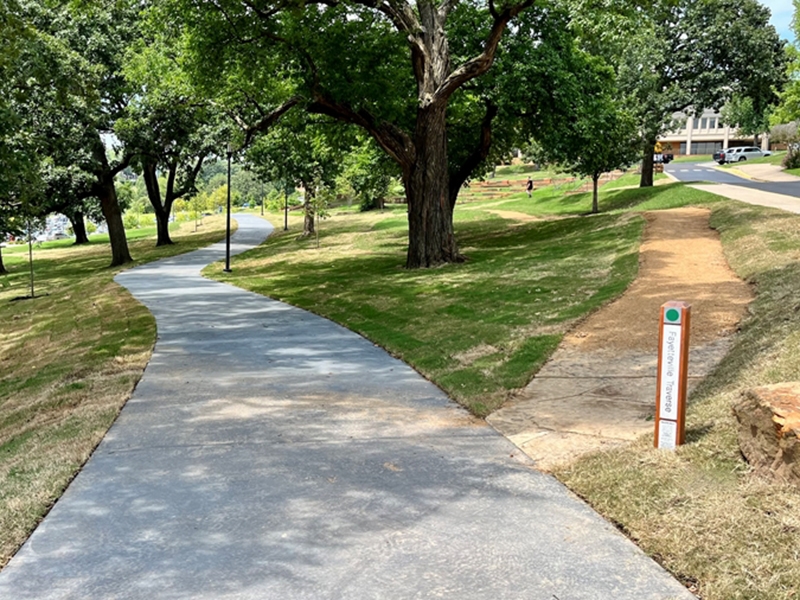 Confluence of the Oak Ridge paved trail and Fayetteville Traverse trail on the U of A campus.