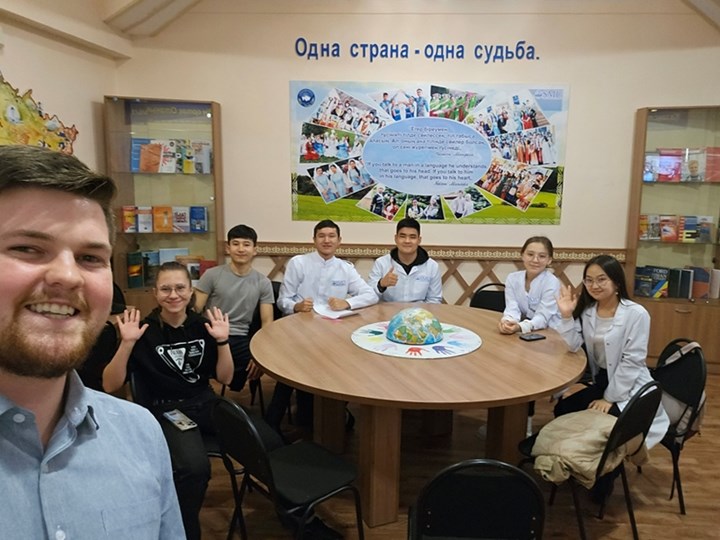 Spencer Hazeslip (BA '23), a current Fulbrighter teaching English in Kazakhstan, with some of his students.