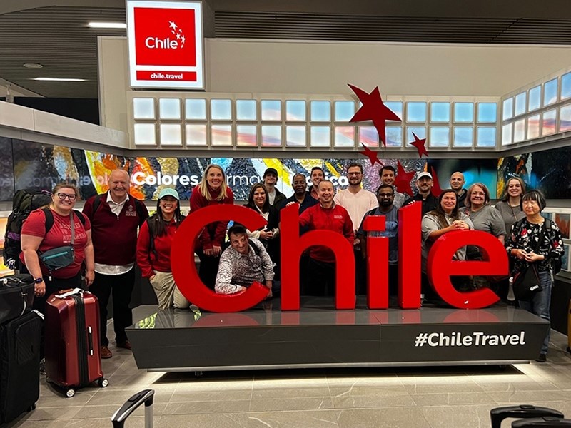 Alyssa Eby, third from left, and the rest of the Executive M.B.A. travelers to Chile arrive at the Arturo Merino Benitez International Airport.