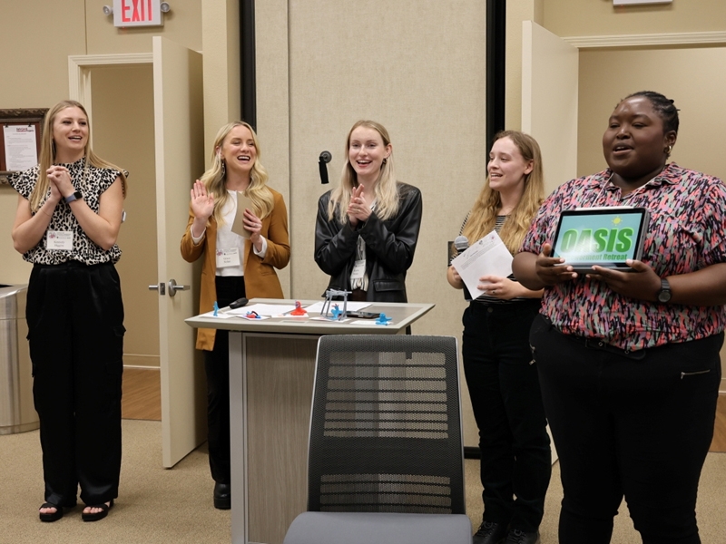 I4H Academy winning team pitching "oasis empowerment retreat," Summer camp for youth with disabilities.