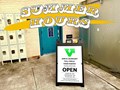 "Summer Hours" text across the entrance of the Full Circle Food Pantry door