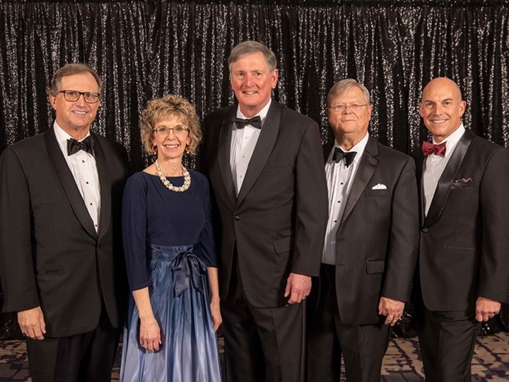 The 2023 Arkansas Business Hall of Fame inductees (l-r) Curt Bradbury, chief operating officer of Stephens Inc.; Judy R. McReynolds, chairman, president and CEO of ArcBest; Ross M. Whipple, president and CEO of Horizon Capital Partners LLLP; and E. Fletcher Lord Jr., chairman of the board of Bumper to Bumper/Crow-Burlingame Co. stand with Walton College Dean Matt Waller.