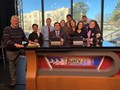 Professor Larry Foley, left, with students in the UATV studios.